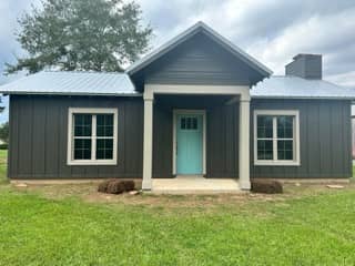 Custom home with bronze wood siding in Bay Minette, Alabama
