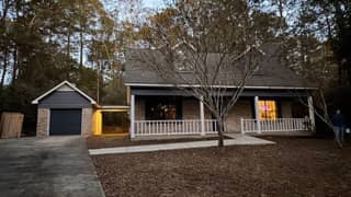 Blue wood siding with white trim front-view repaint in Daphne, Alabama