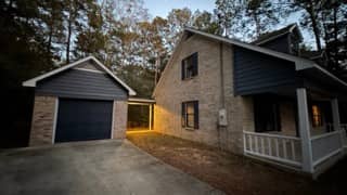 Blue wood siding with white trim full elevation in Daphne, Alabama