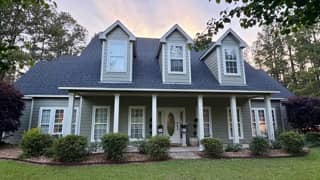 Warm beige wood siding exterior repaint in Foley, Alabama