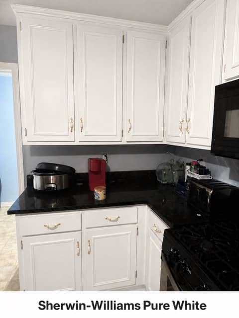 Kitchen cabinets with a second color or accent surface treated