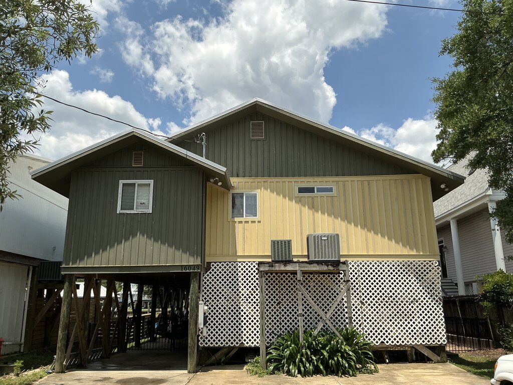 Two Tone Olive And Yellow Stilt House Repaint — Exterior Painting in Fairhope, Baldwin County, Alabama by Paint Doctors LLC.