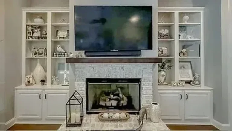 Customer living room before — white built-in bookcases around the fireplace
