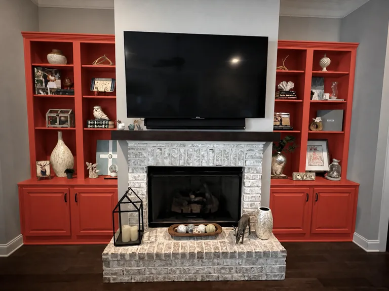 Paint Guru render — built-in bookcases either side of the fireplace in Cayenne