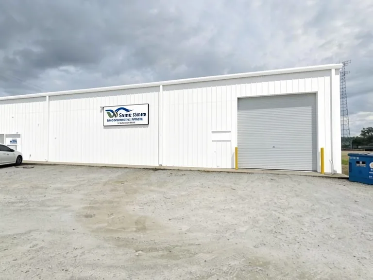 Paint Guru render — metal warehouse siding, fascia and man door repainted Extra White