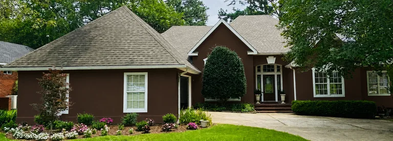 Paint Guru render — stucco body deepened to Cavern Clay red-brown